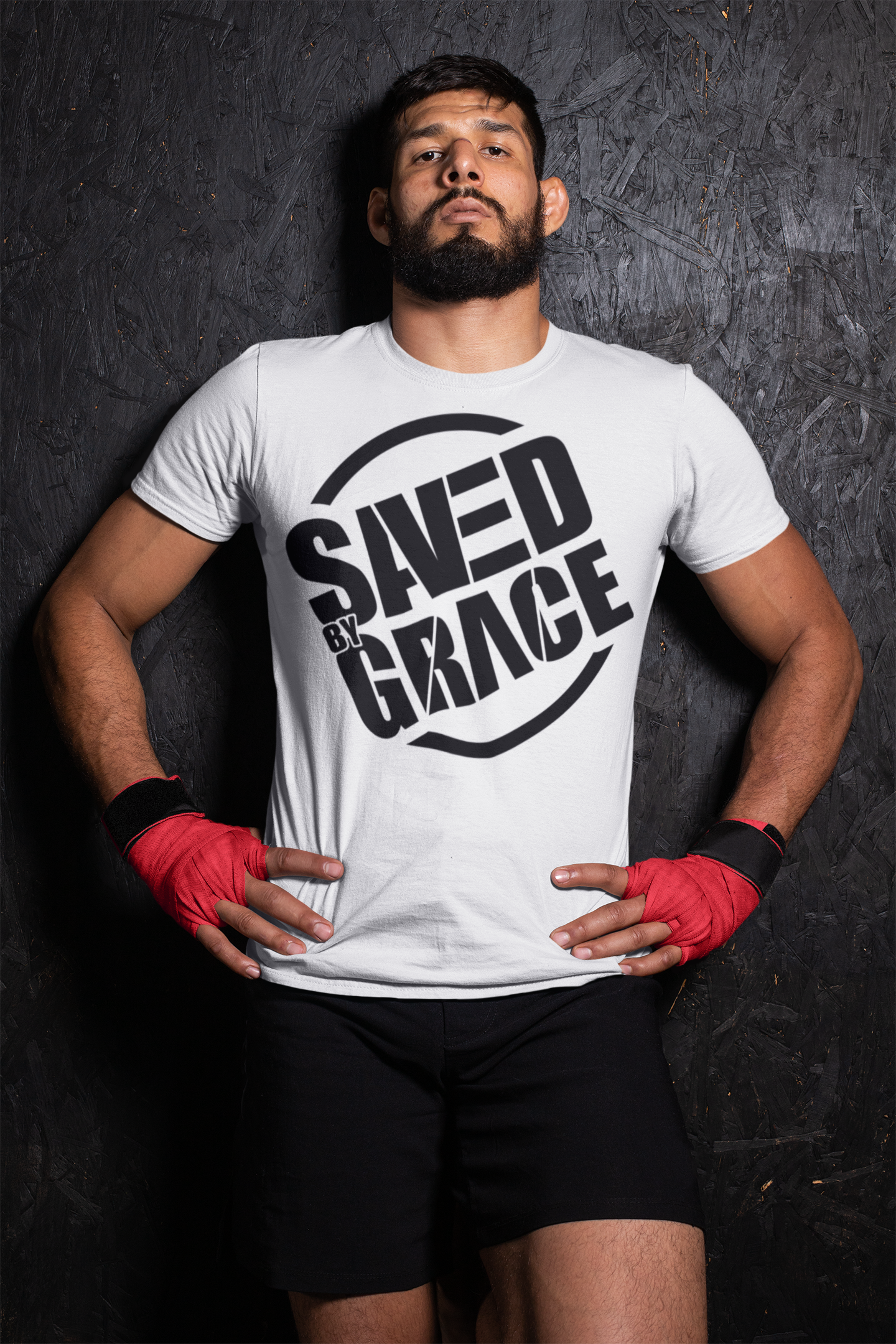 MMA fighter wearing white shirt with black text reading saved by grace